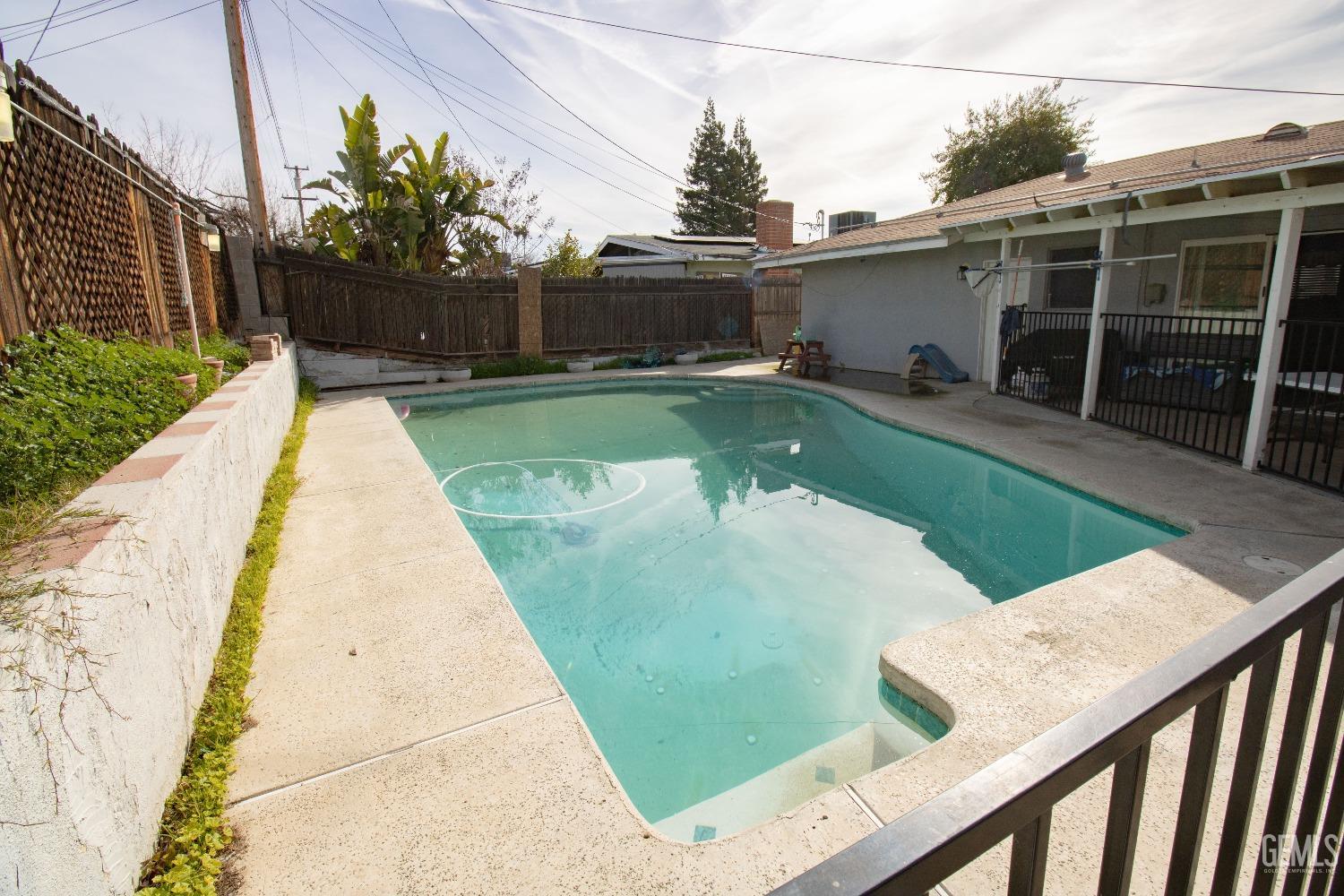 Undisclosed Address Bakersfield, CA 93306 - Photo 8 of 9 a view of swimming pool with outdoor seating and plants