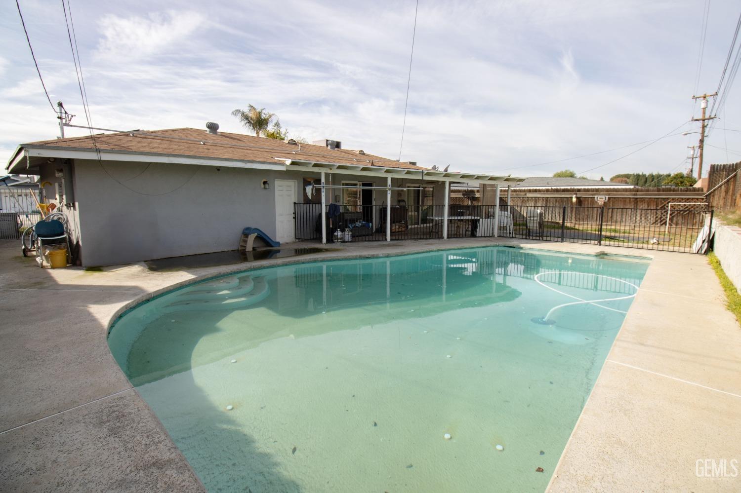 Undisclosed Address Bakersfield, CA 93306 - Photo 9 of 9 a view of a swimming pool with a yard