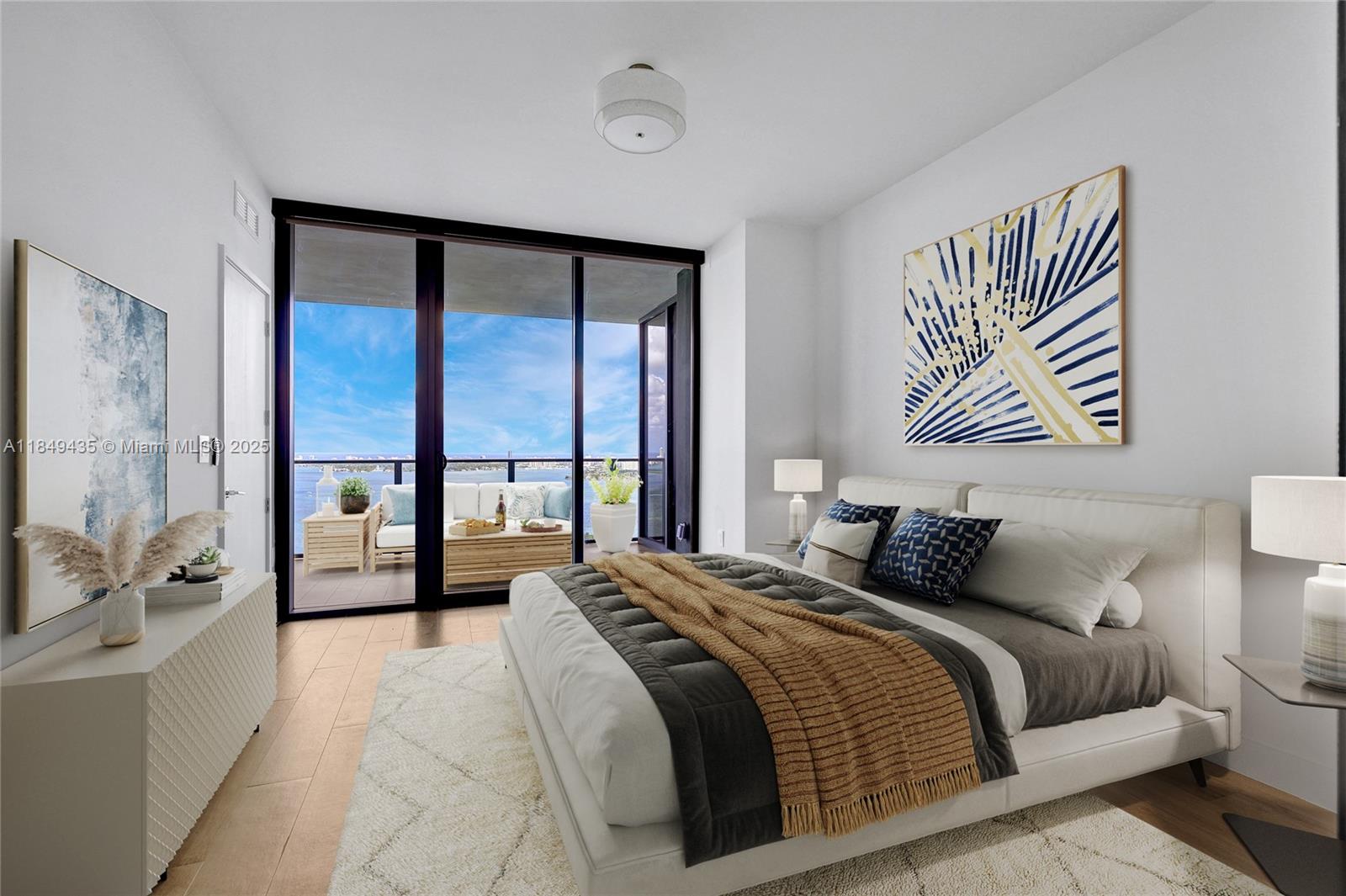 700 Northeast 24th Street, Unit 4005 Miami, FL 33137 - Photo 13 of 89 a bedroom with a large bed and a large window