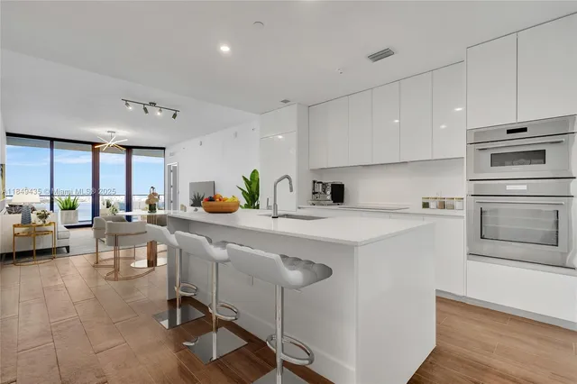 a bathroom with a sink toilet vanity and shower