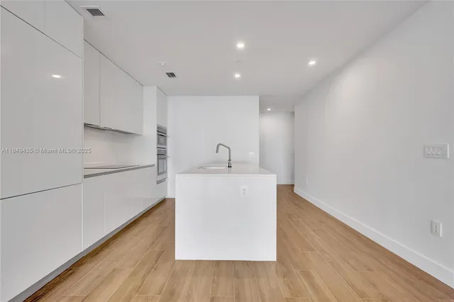 a view of a park with swings and slides