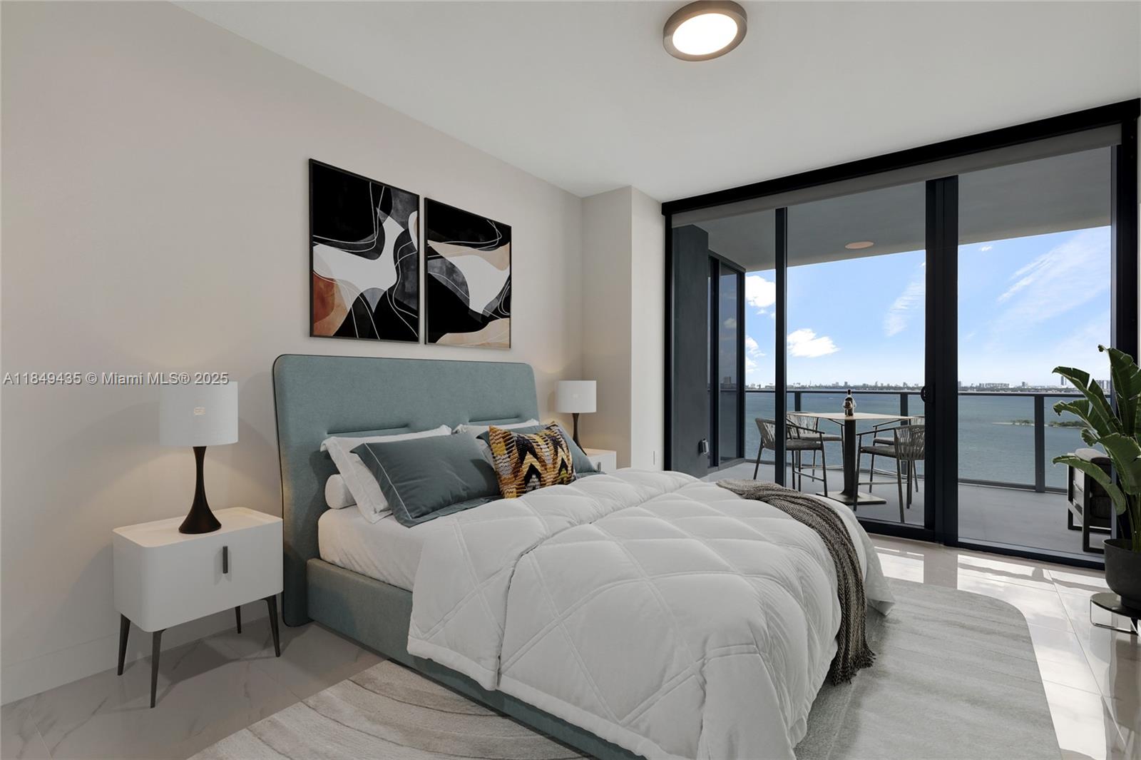 700 Northeast 24th Street, Unit 4005 Miami, FL 33137 - Photo 26 of 89 a bedroom with a large bed and a balcony view