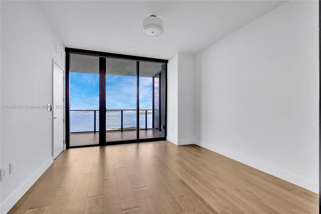 a dining room with furniture a chandelier and entryway