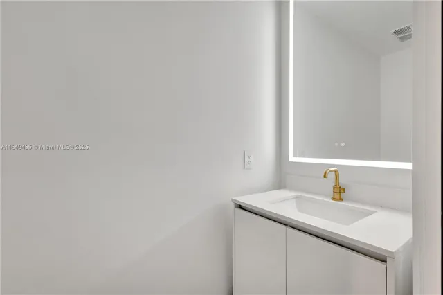 a balcony with furniture and a potted plant