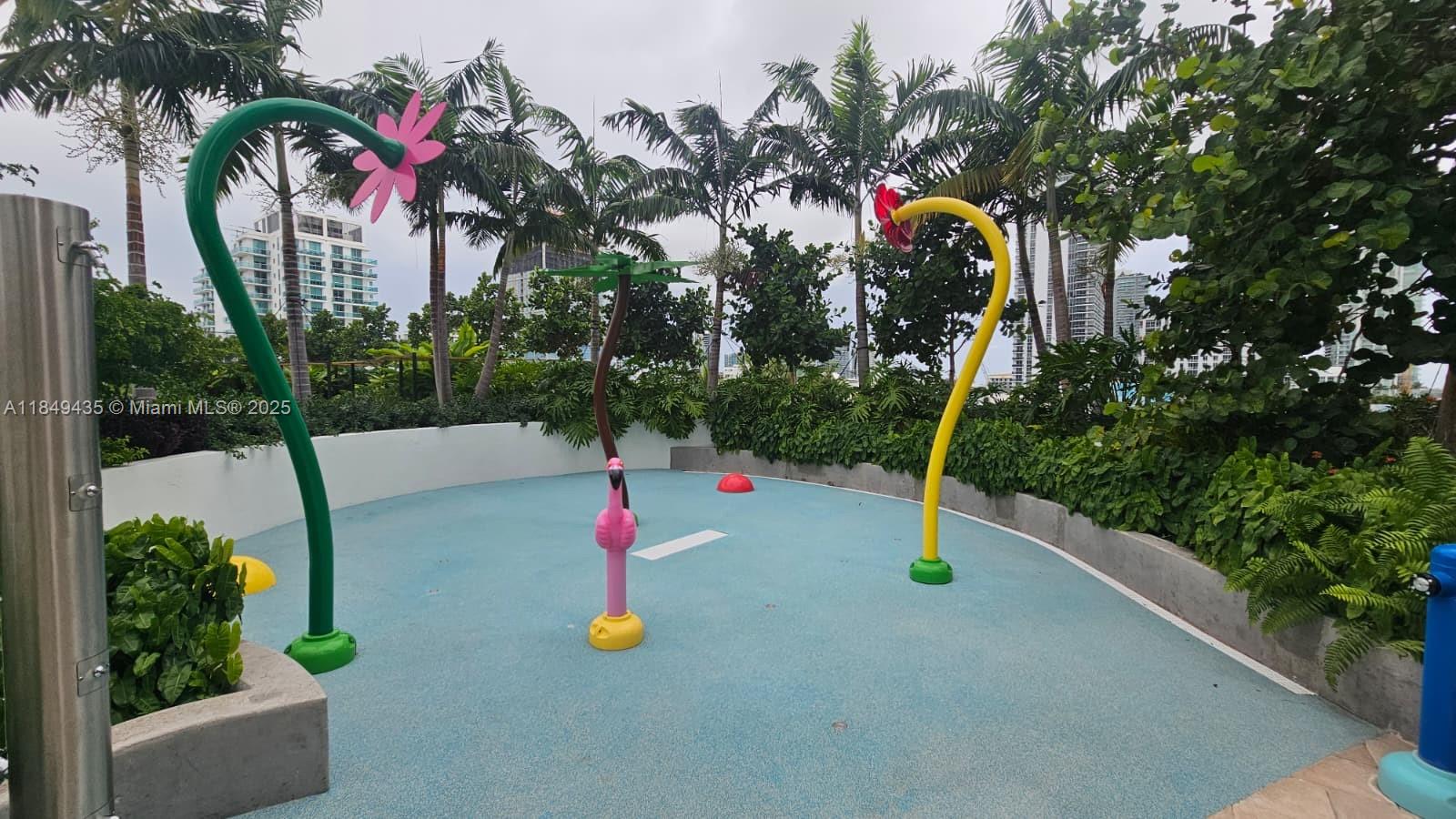 700 Northeast 24th Street, Unit 4005 Miami, FL 33137 - Photo 54 of 89 a view of a park with swings and slides