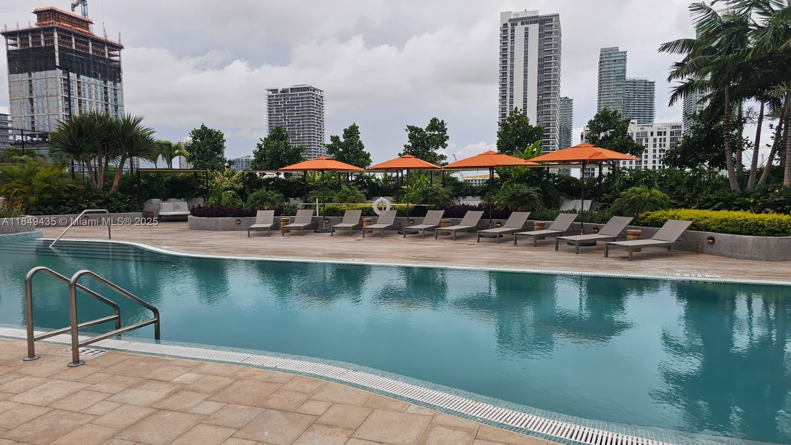 700 Northeast 24th Street, Unit 4005 Miami, FL 33137 - Photo 60 of 89 a house with swimming pool and outdoor space