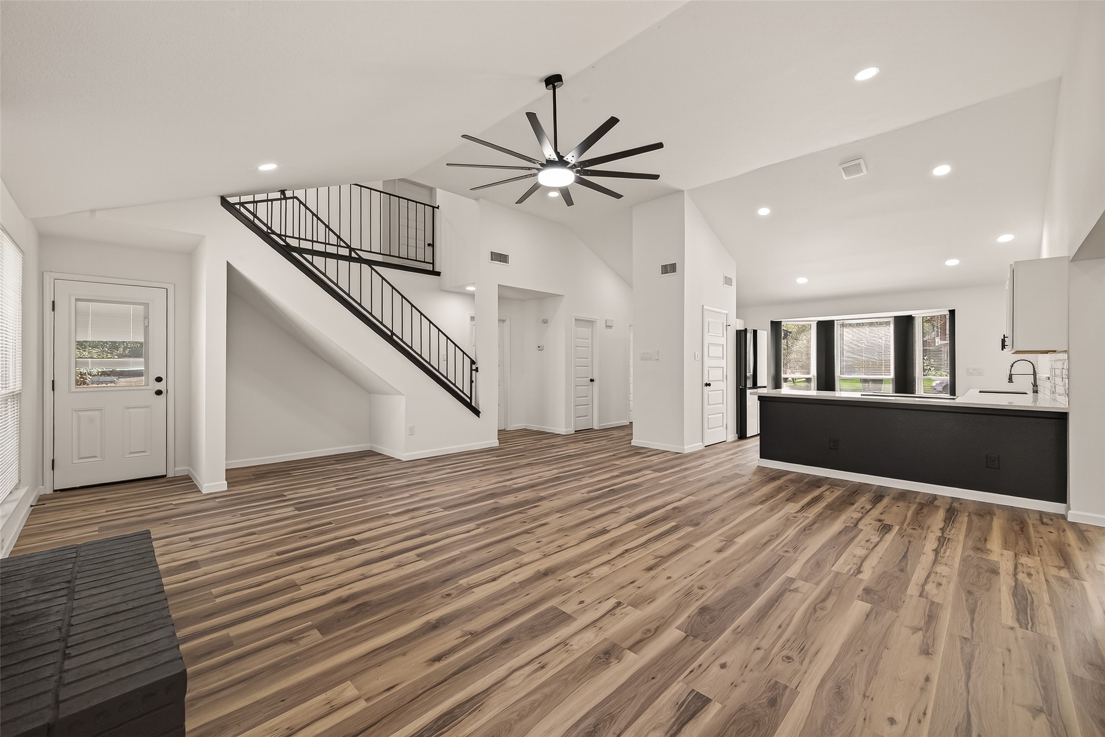 2915 Whispering Springs Drive Spring, TX 77373 - Photo 6 of 36 Open living area with sleek modern staircase railing and seamless flow into the main living spaces.