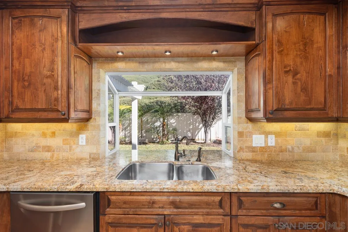 2002 Paseo Laro San Clemente, CA 92673 - Photo 18 of 37 a kitchen with granite countertop a sink and cabinets
