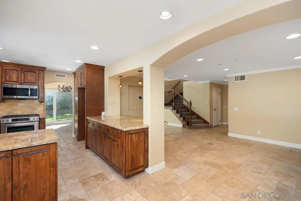 2002 Paseo Laro San Clemente, CA 92673 - Photo 22 of 37 a kitchen with stainless steel appliances granite countertop a refrigerator and a stove top oven