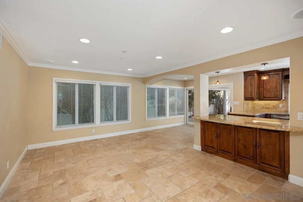 2002 Paseo Laro San Clemente, CA 92673 - Photo 23 of 37 a large white kitchen with granite countertop a sink and a large mirror