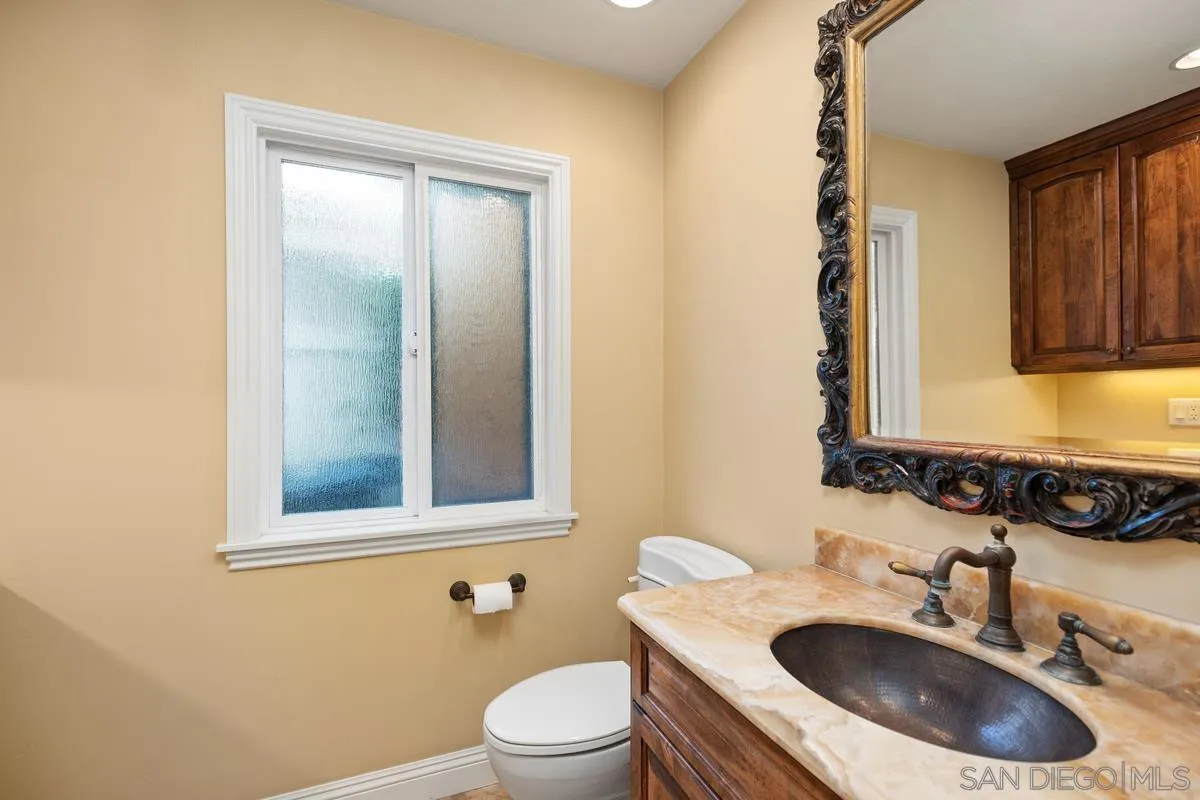 2002 Paseo Laro San Clemente, CA 92673 - Photo 24 of 37 a bathroom with a sink toilet and mirror