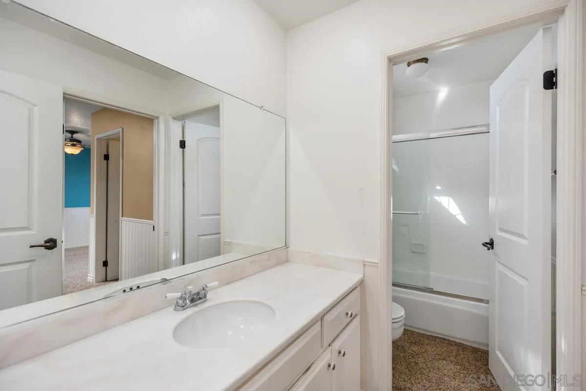 2002 Paseo Laro San Clemente, CA 92673 - Photo 27 of 37 a bathroom with a sink a toilet and shower