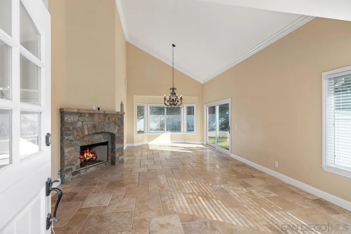 2002 Paseo Laro San Clemente, CA 92673 - Photo 8 of 37 a view of an empty room with fireplace and a window