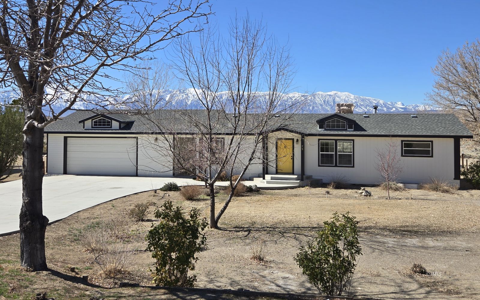 75 Sequoia Street Bishop, CA 93514 - Photo 1 of 21 a front view of a house with a yard