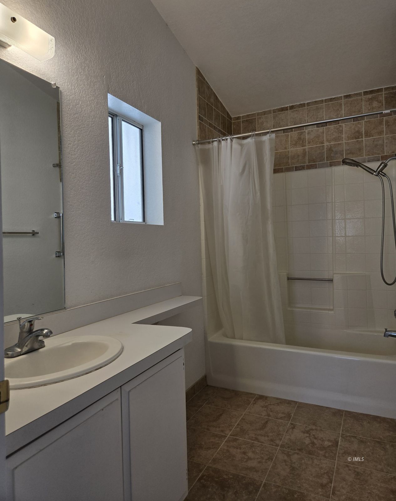 75 Sequoia Street Bishop, CA 93514 - Photo 11 of 21 a bathroom with a sink a vanity and a mirror