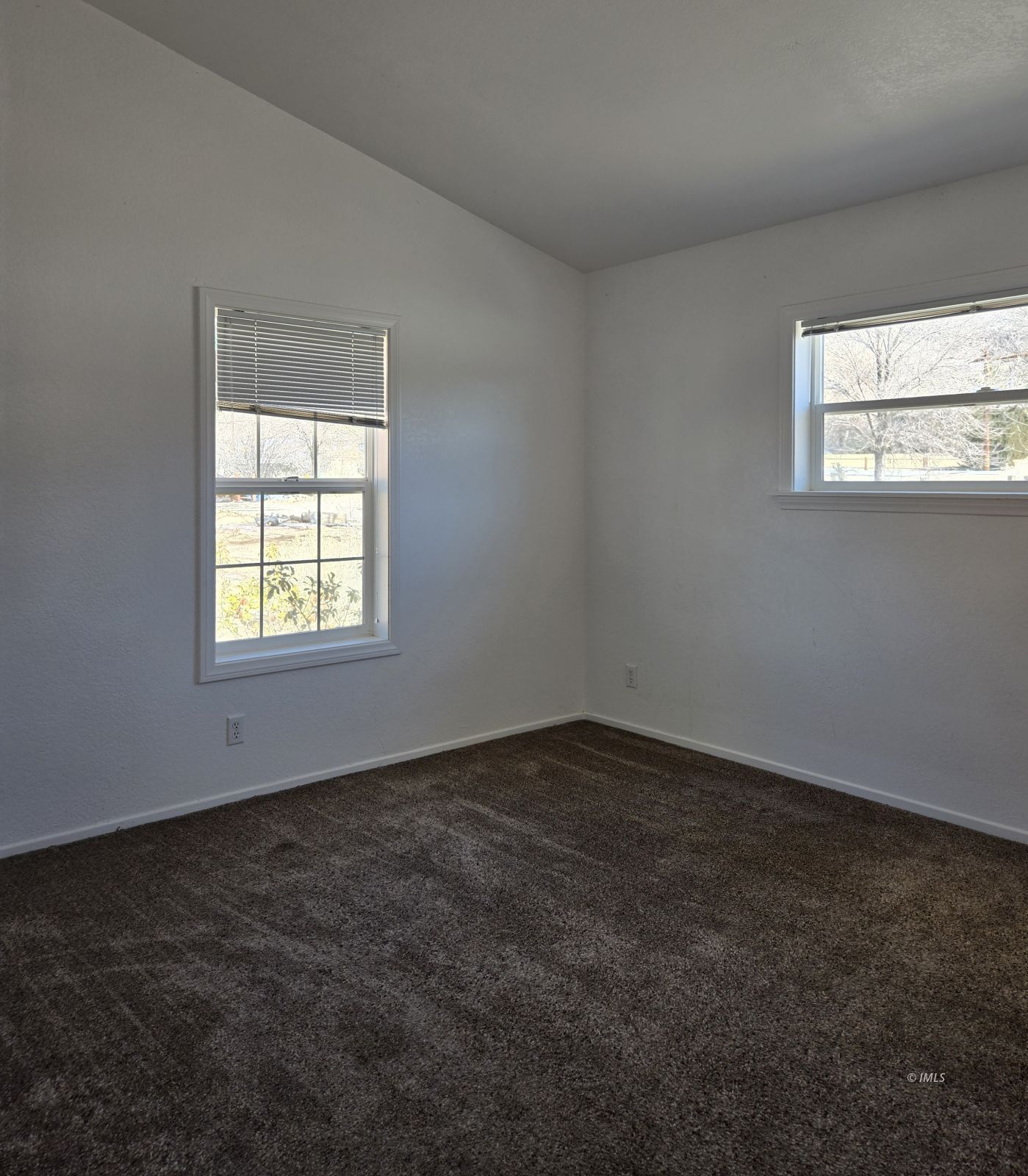 75 Sequoia Street Bishop, CA 93514 - Photo 8 of 21 an empty room with a window