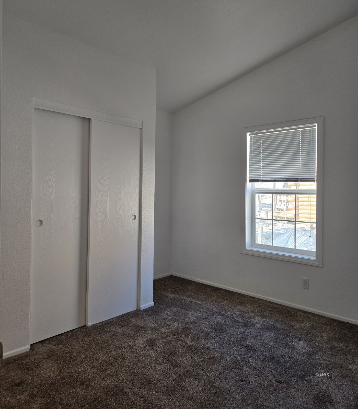 75 Sequoia Street Bishop, CA 93514 - Photo 9 of 21 an empty room with a window