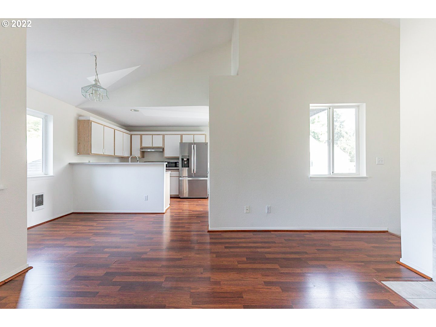 5225 Jean Road, Unit 207 Lake Oswego, OR 97035 - Photo 14 of 29 a view of empty room with wooden floor and kitchen view