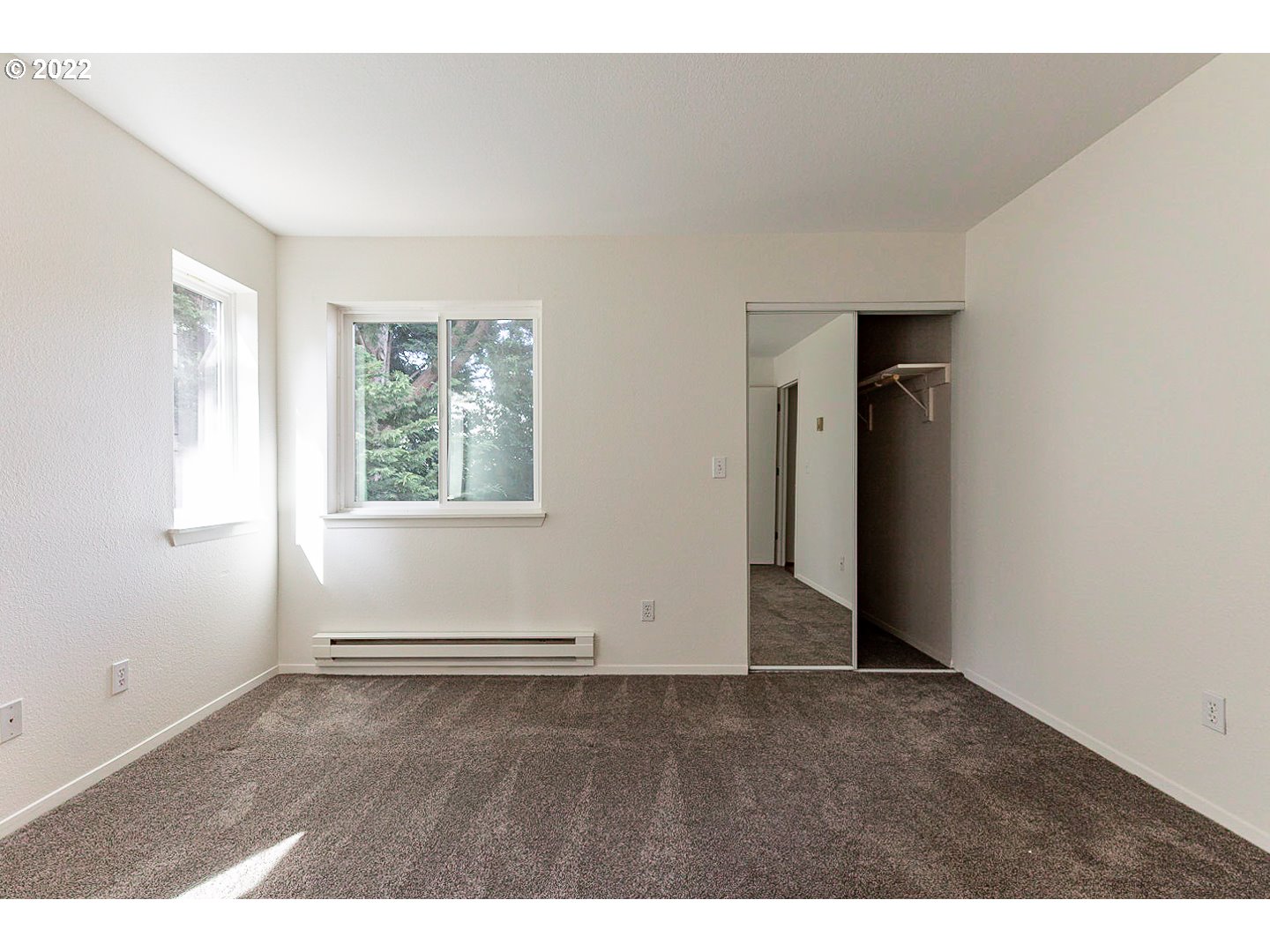 5225 Jean Road, Unit 207 Lake Oswego, OR 97035 - Photo 16 of 29 an empty room with wooden floor and windows