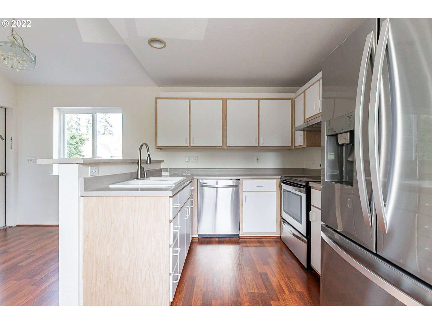 5225 Jean Road, Unit 207 Lake Oswego, OR 97035 - Photo 2 of 29 a kitchen with stainless steel appliances granite countertop a refrigerator sink and stove
