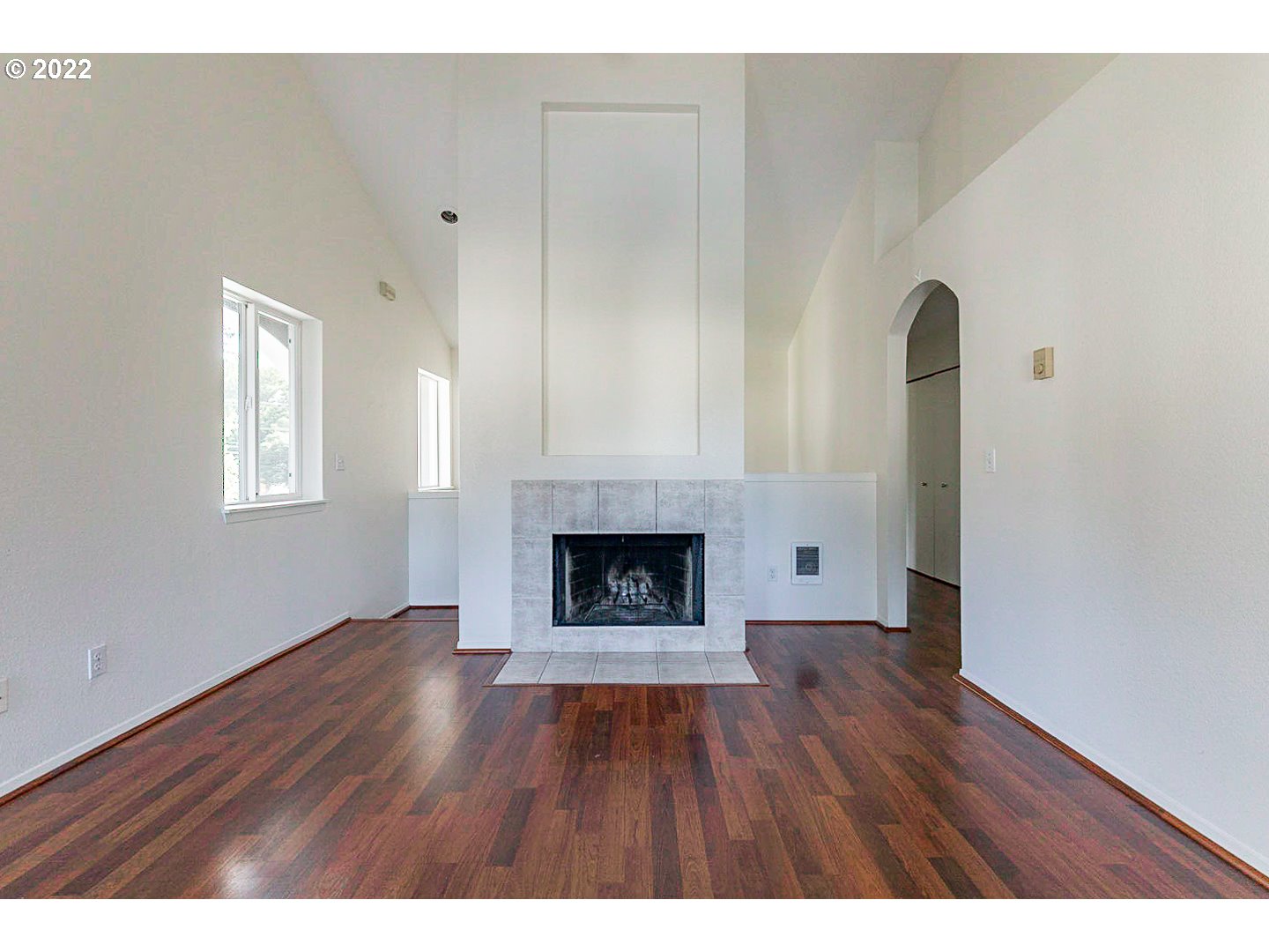 5225 Jean Road, Unit 207 Lake Oswego, OR 97035 - Photo 3 of 29 a view of an empty room with a fireplace and a window