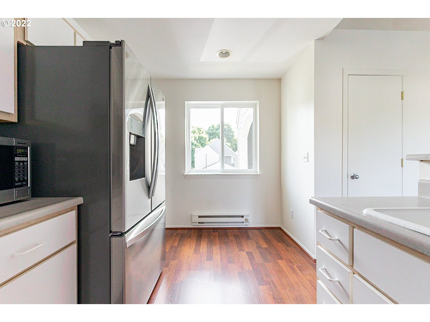 5225 Jean Road, Unit 207 Lake Oswego, OR 97035 - Photo 6 of 29 a kitchen with a refrigerator and a sink