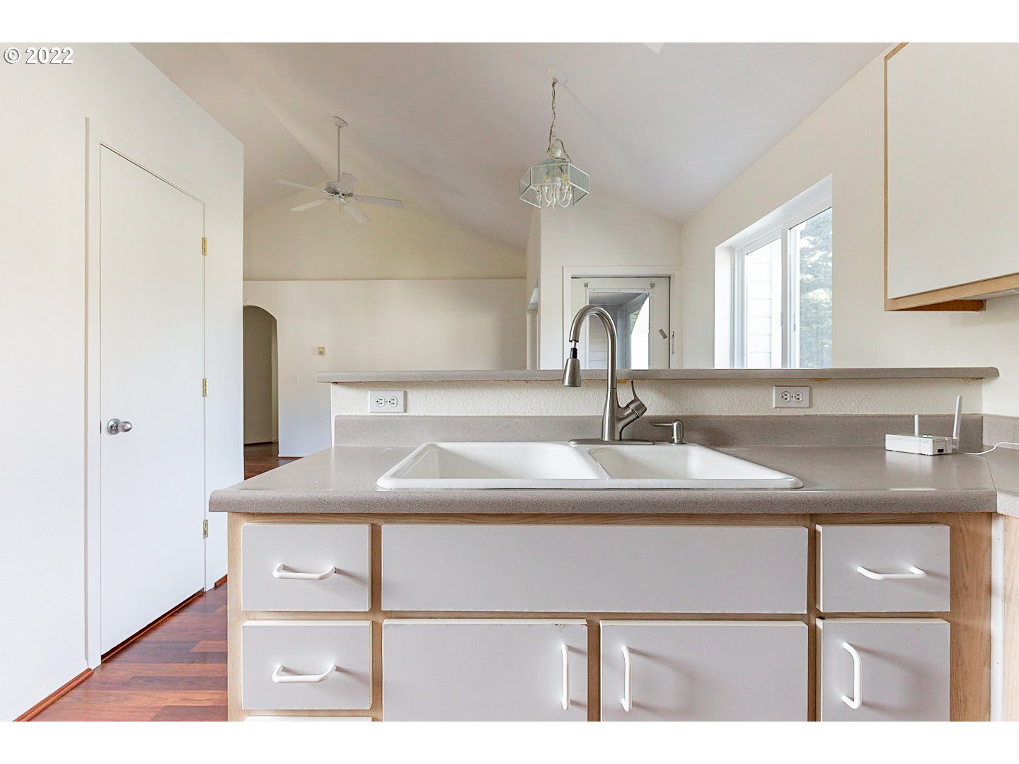 5225 Jean Road, Unit 207 Lake Oswego, OR 97035 - Photo 7 of 29 a kitchen with a sink cabinets and a wooden floor