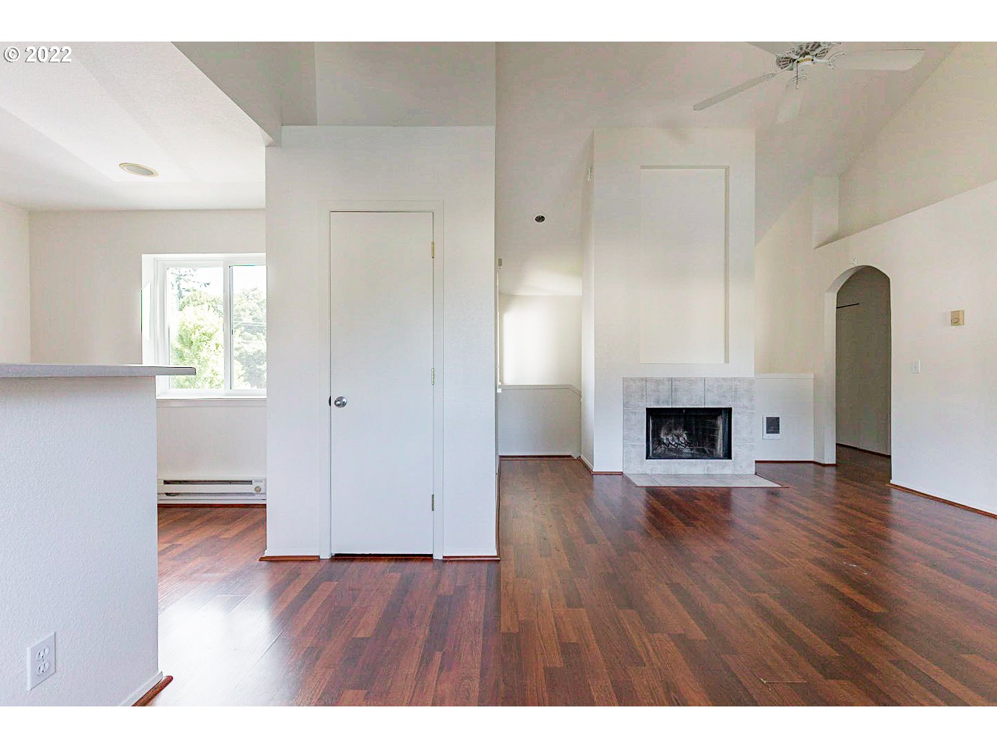 5225 Jean Road, Unit 207 Lake Oswego, OR 97035 - Photo 10 of 29 a view of empty room with wooden floor and fireplace