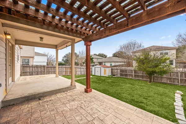 a view of a backyard with pathway
