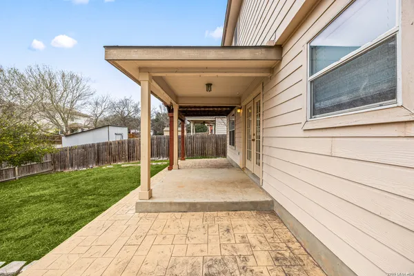 a front view of a house with a garden and yard