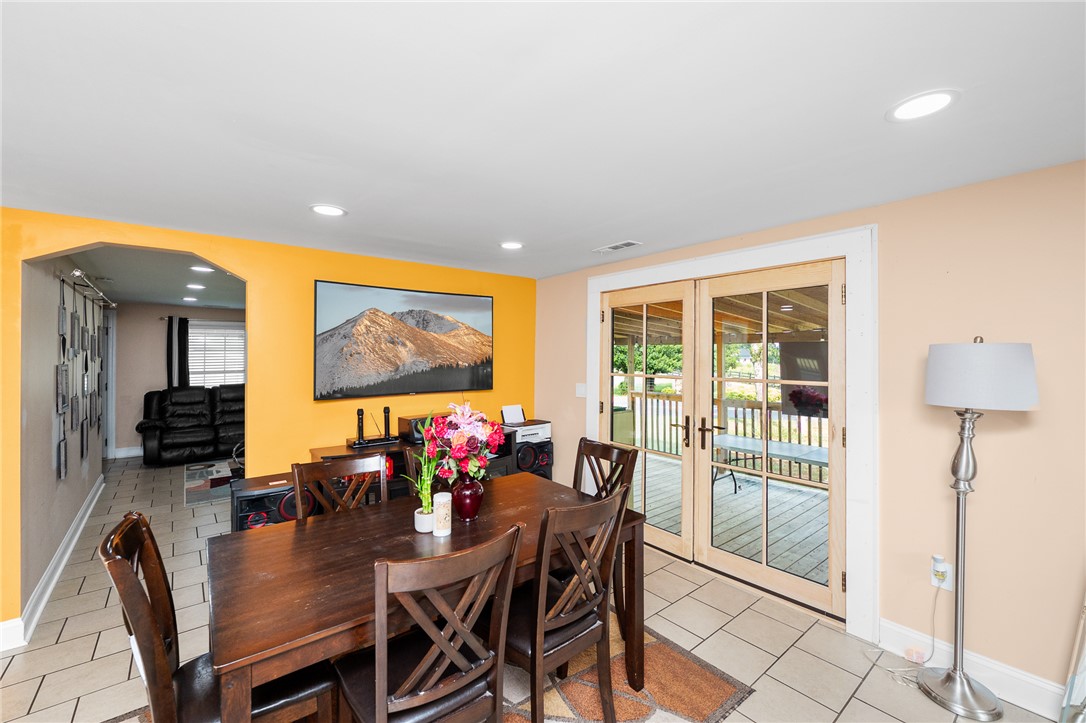 358 Finley Road Easley, SC 29642 - Photo 7 of 20 This inviting dining area features elegant French doors and durable tile flooring, creating a perfect space for gatherings.