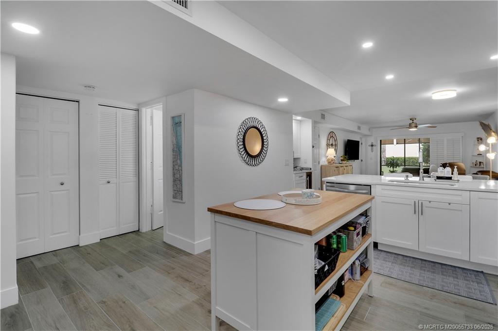 1001 Keystone Drive, Unit A Jupiter, FL 33458 - Photo 8 of 30 a kitchen that has a lot of cabinets in it