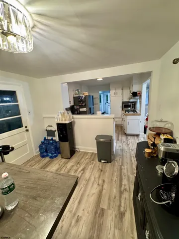 a kitchen with sink refrigerator and stove