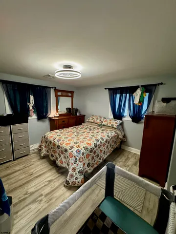 a bedroom with bed and window