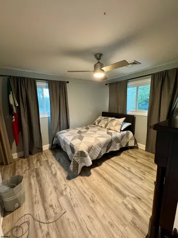 a bedroom with double bed and a window