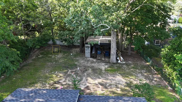 a view of a wooden deck with a yard