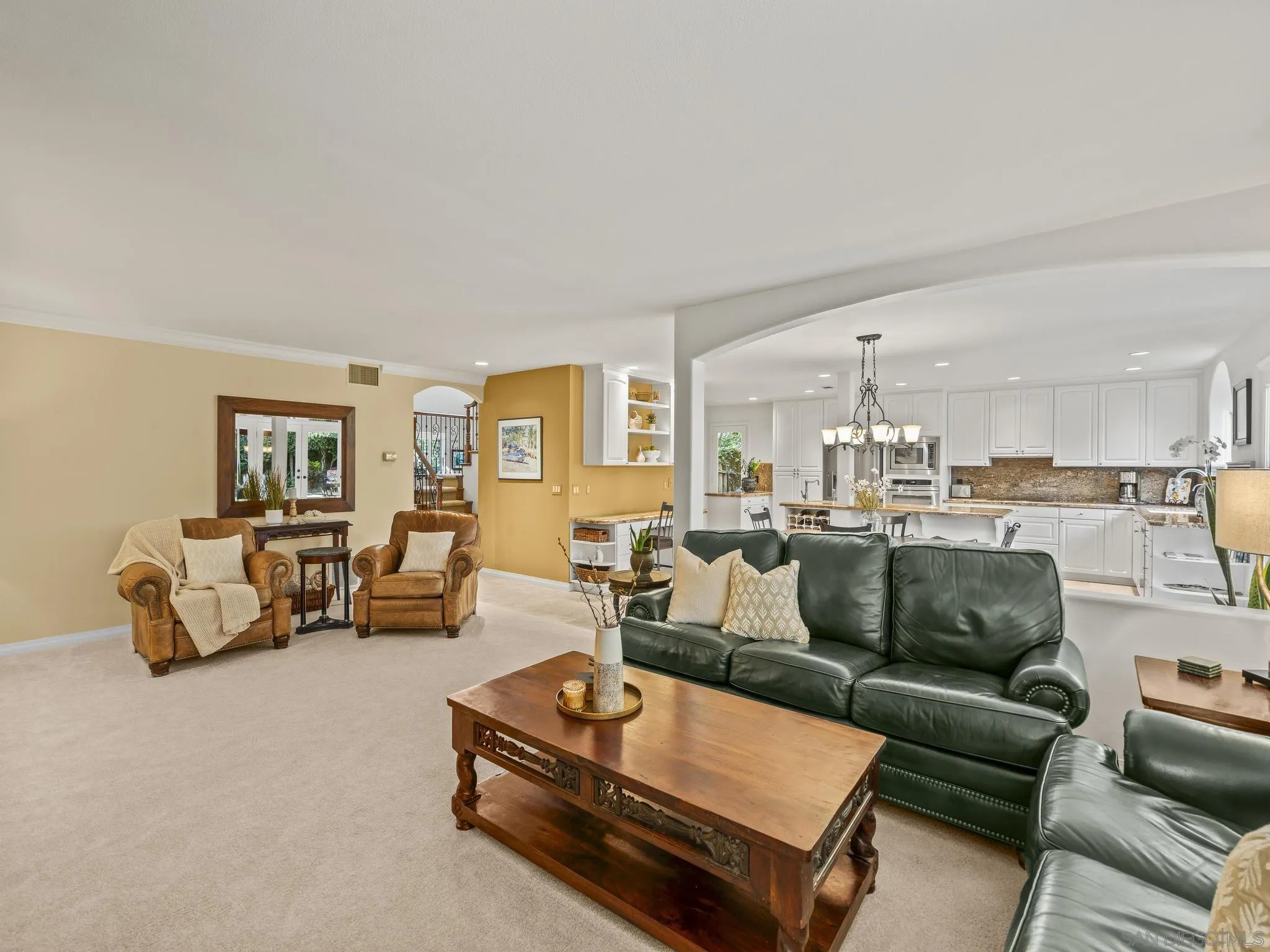 6502 La Paloma Street Carlsbad, CA 92009 - Photo 18 of 60 a living room with furniture and a dining table with wooden floor