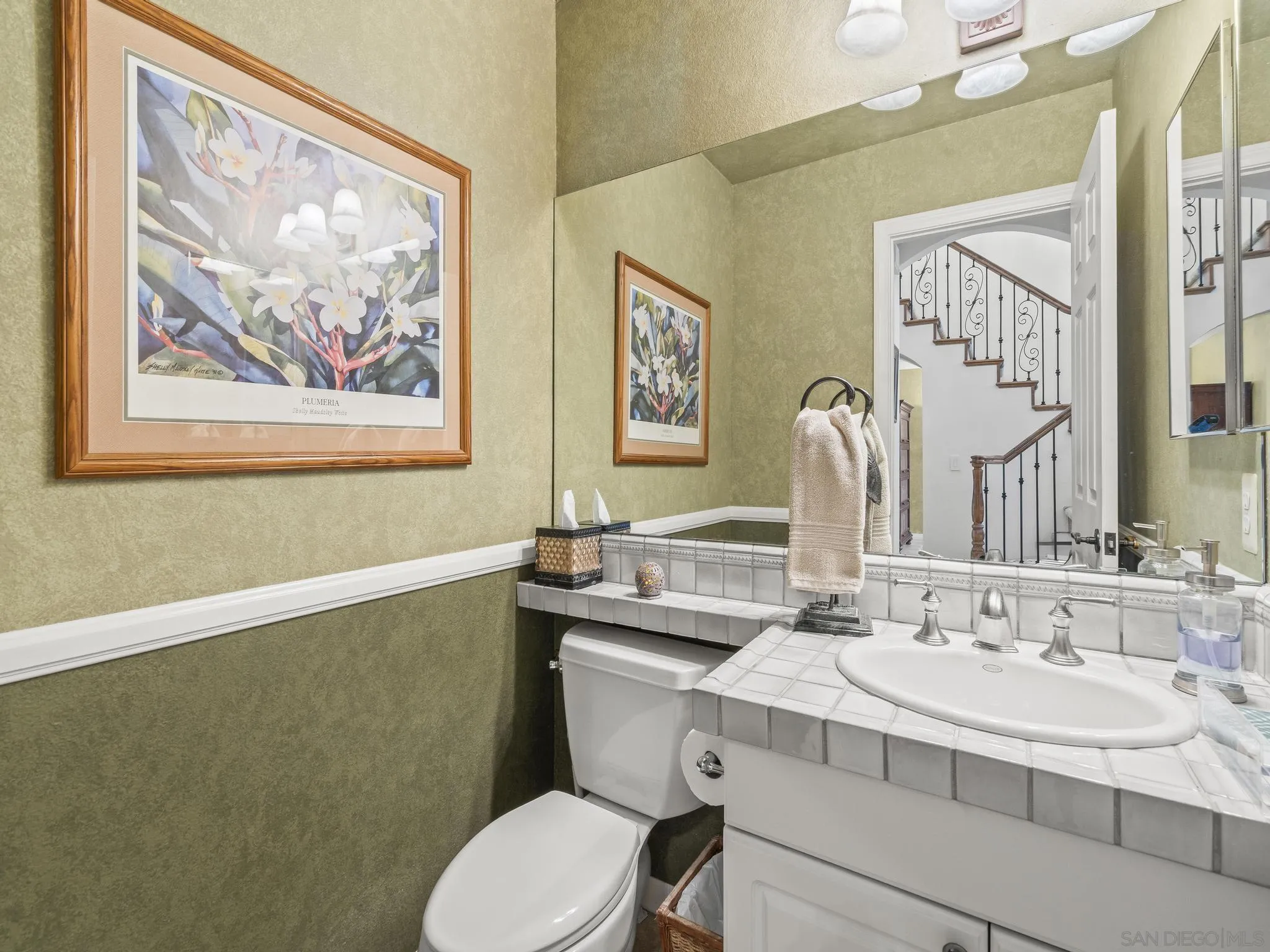 6502 La Paloma Street Carlsbad, CA 92009 - Photo 19 of 60 a bathroom with a sink and a mirror