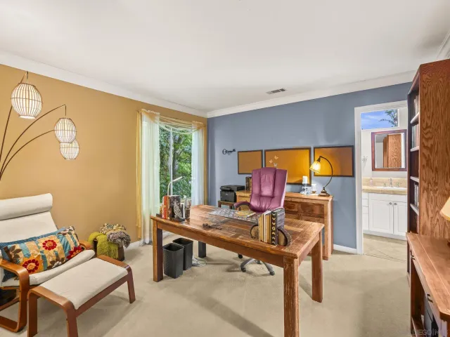 a view of a house with a yard porch and sitting area