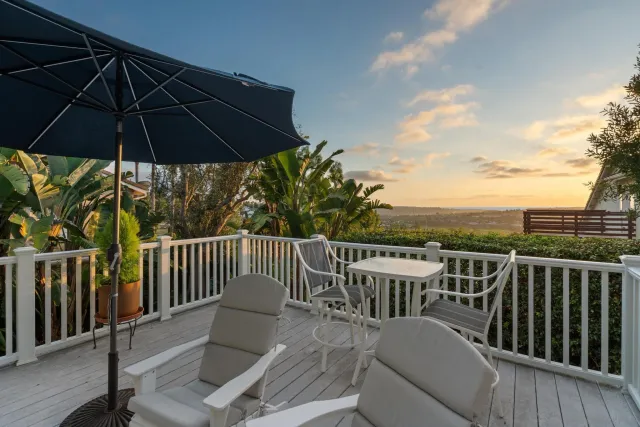 a view of a house with a yard porch and sitting area