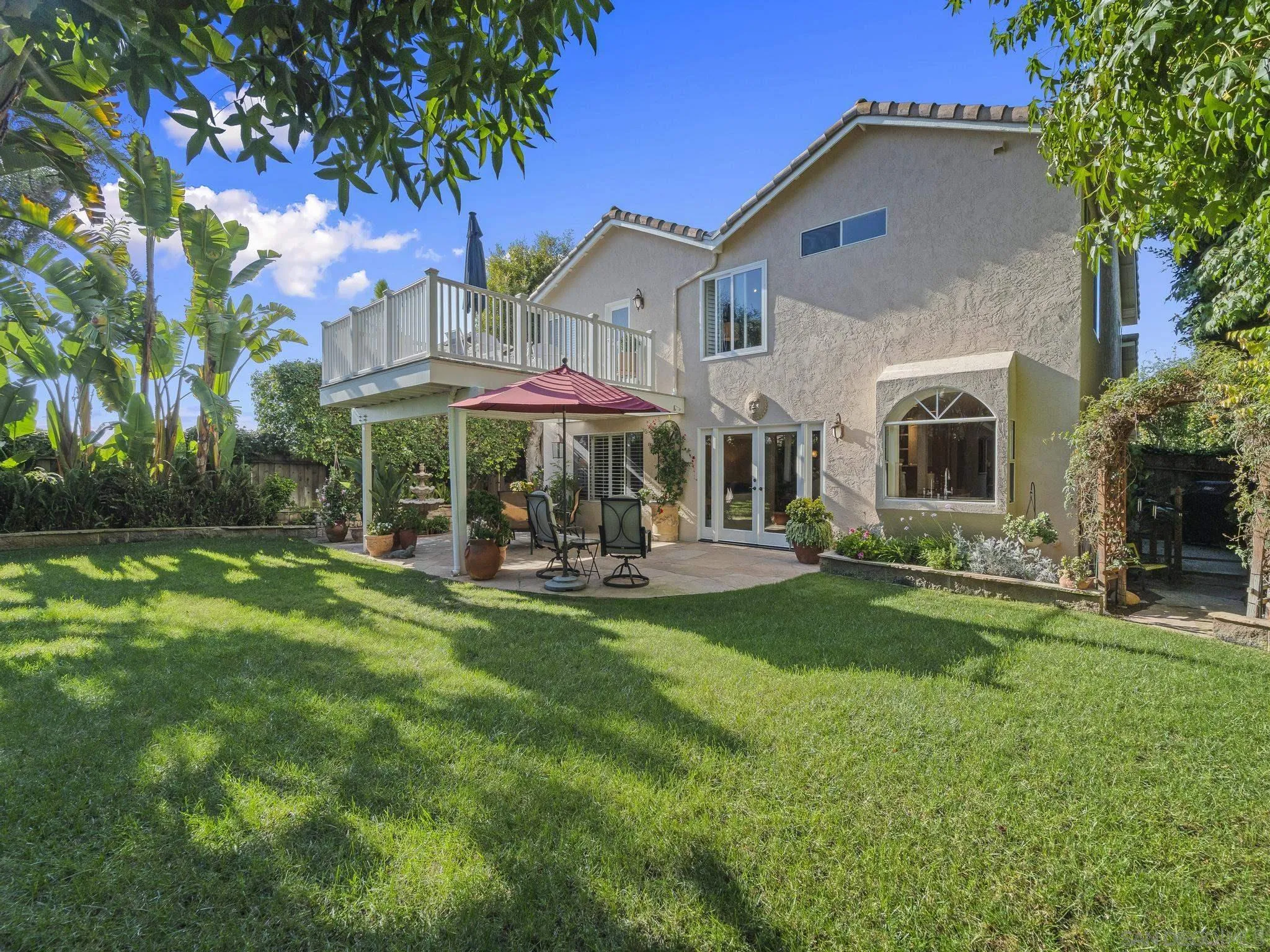 6502 La Paloma Street Carlsbad, CA 92009 - Photo 39 of 60 a view of a house with a yard porch and sitting area
