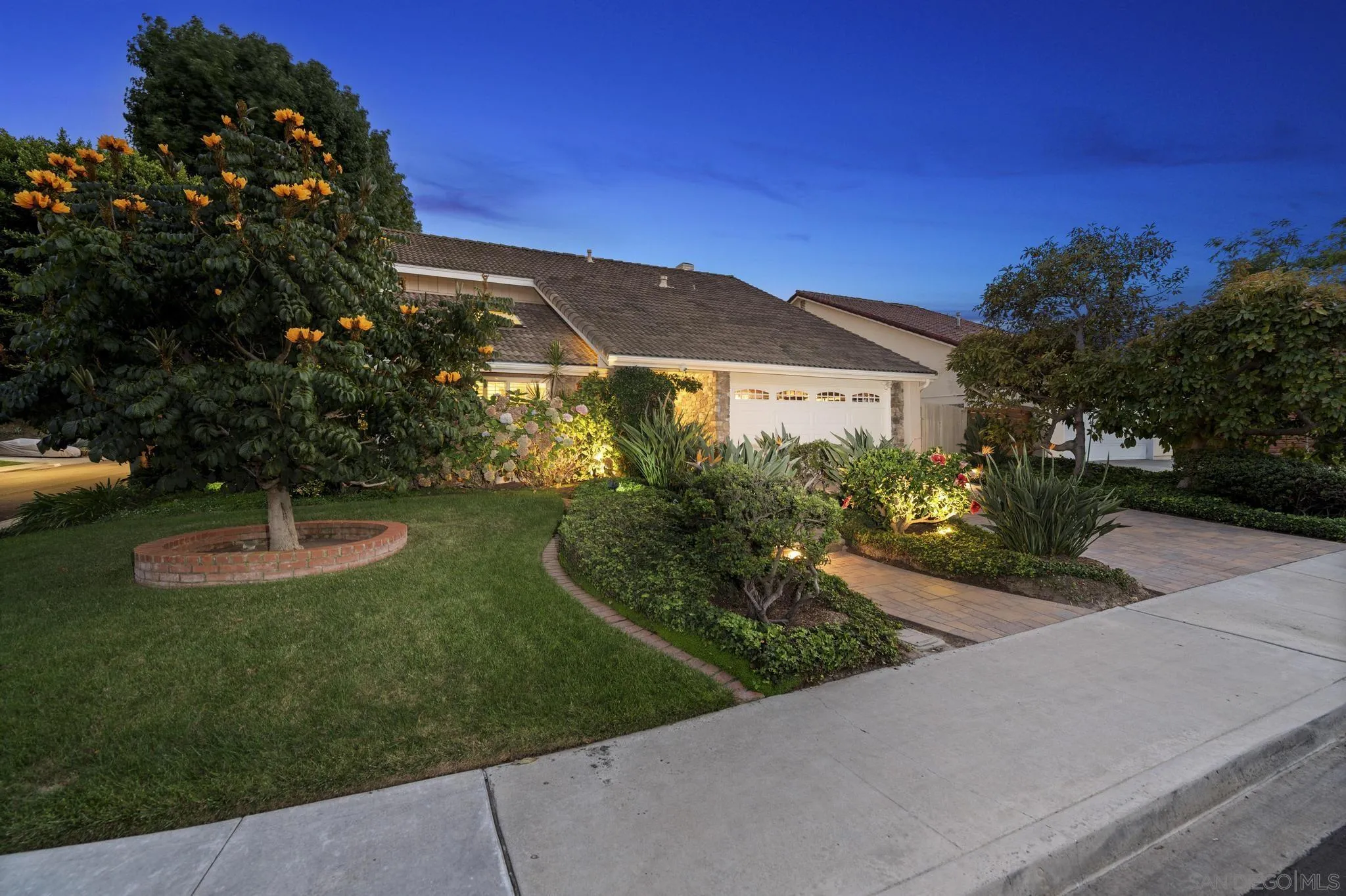 6502 La Paloma Street Carlsbad, CA 92009 - Photo 43 of 60 a front view of a house with a yard