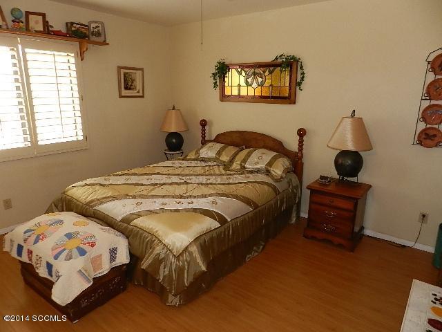 471 Camino Providencia Rio Rico, AZ 85648 - Photo 10 of 49 a bedroom with a bed and a window