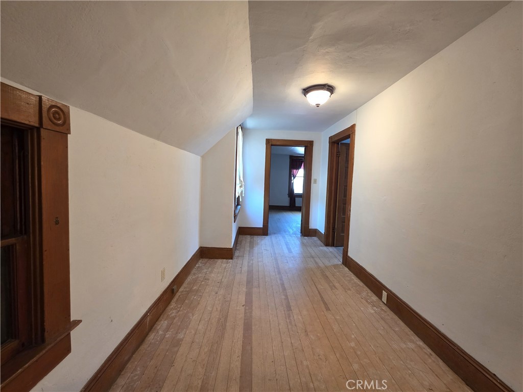 1414 Marin Street Corning, CA 96021 - Photo 19 of 43 a view of a hallway with wooden floor