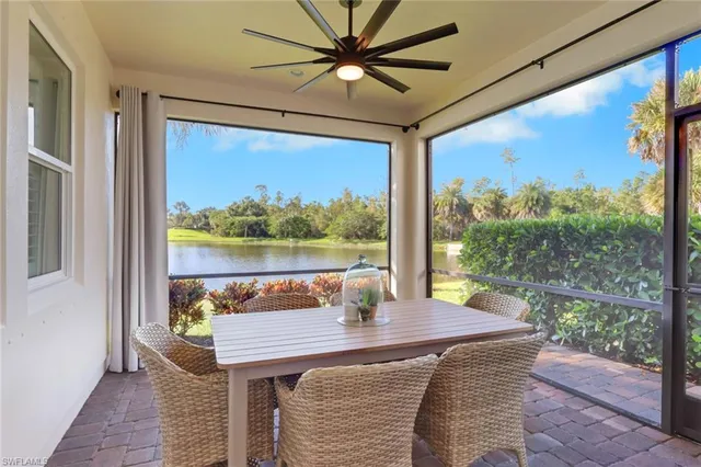 a view of a dining room with a table and chairs