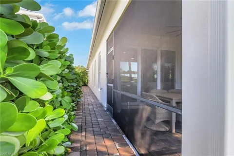 a view of a bunch of flowers in front of house