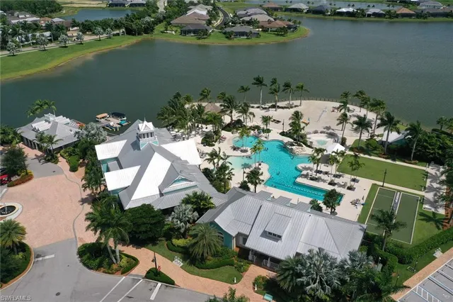 an aerial view of a house with a lake view