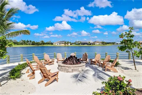a view of a lake with couches and city view