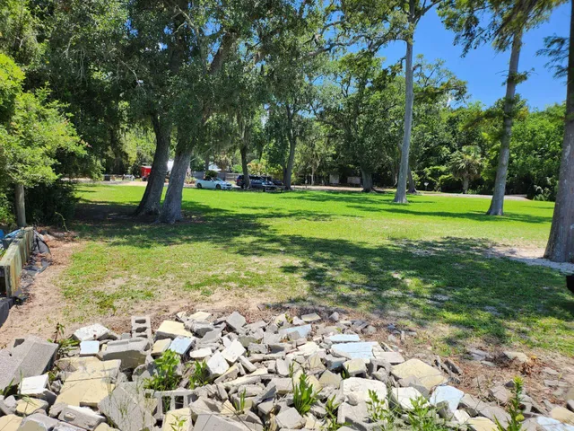 a view of a swimming pool and a yard