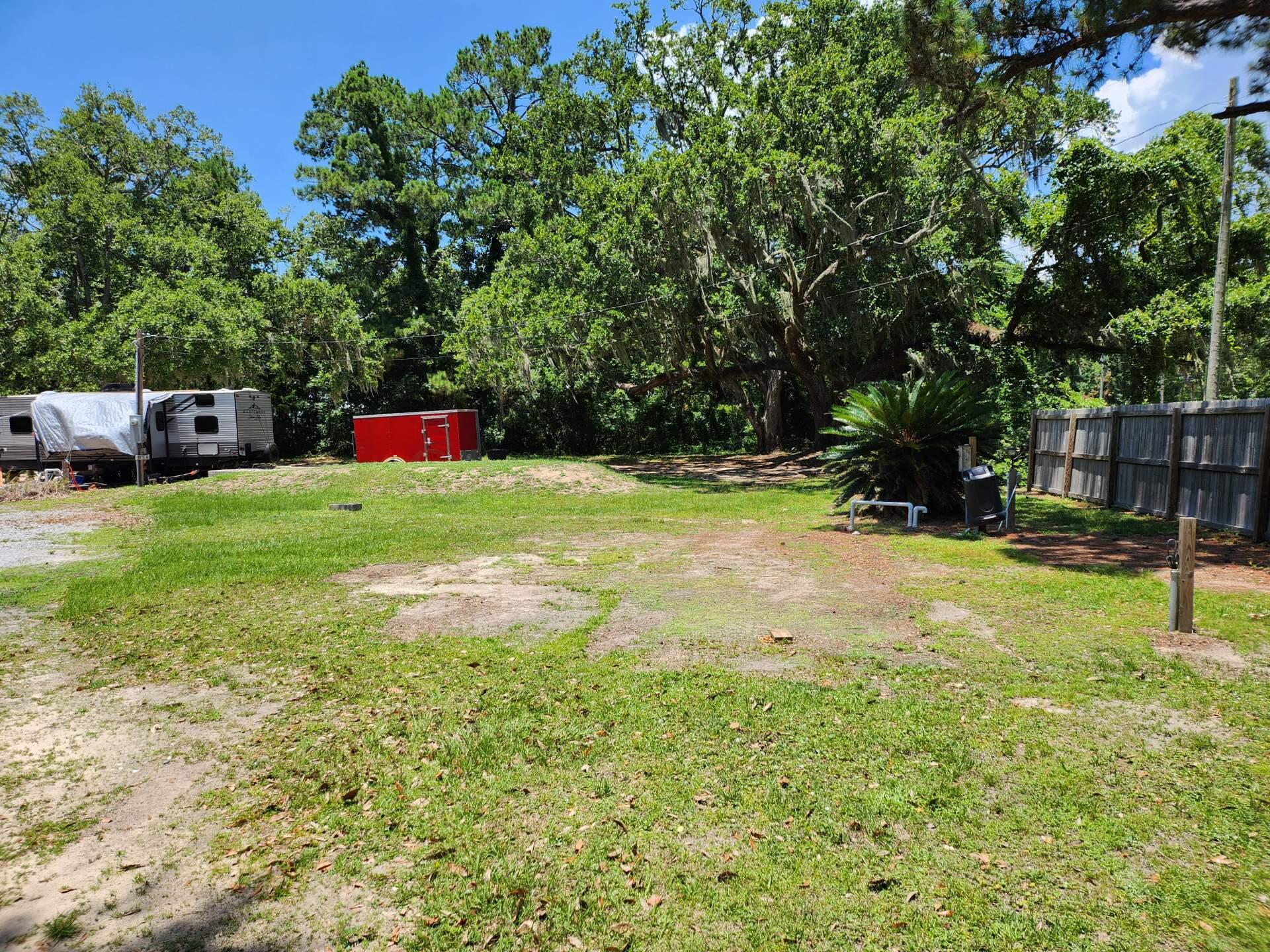 7397 Highway 20 Freeport, FL 32439 - Photo 15 of 23 a view of a backyard with a small cabin